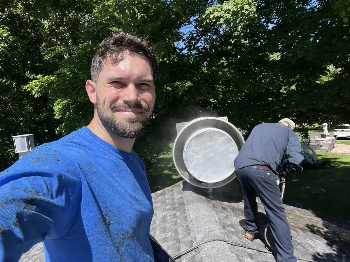 Neil from Hood Guard on a rooftop exhaust job