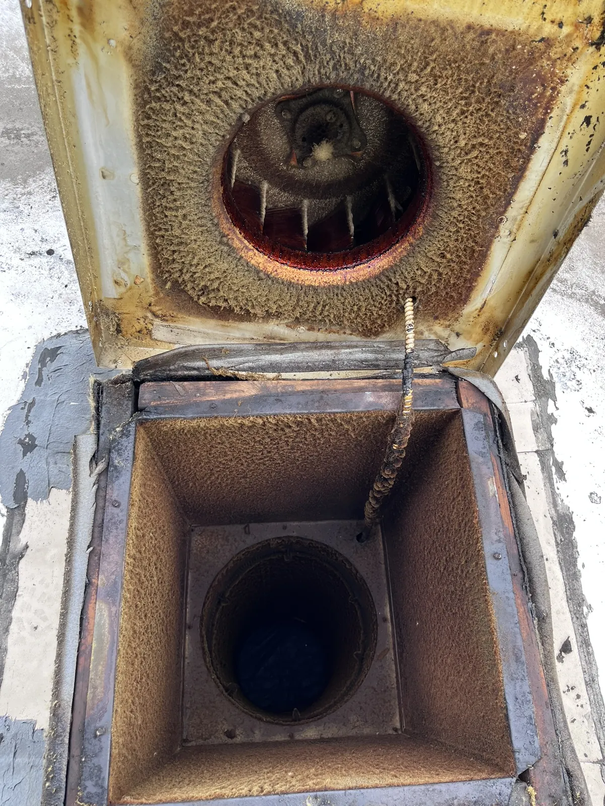 Upblast fan curb & housing before cleaning